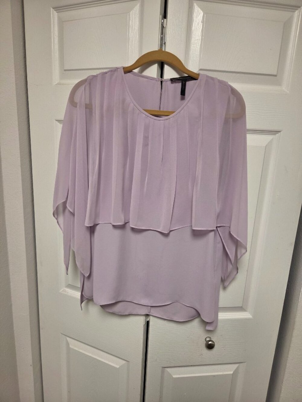 Lilac Fitted top with sheer overlay covering half the chest and arms.